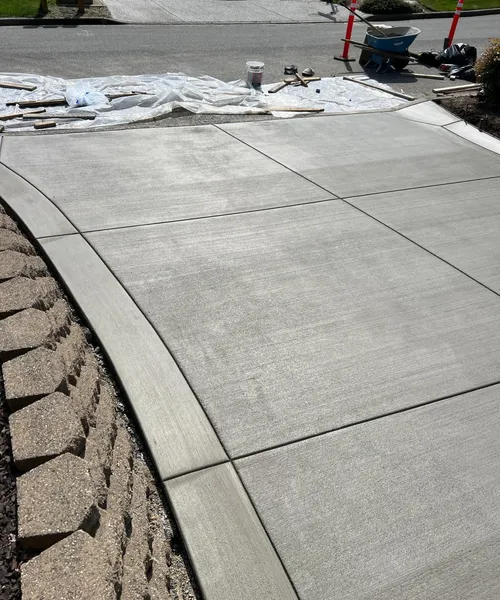 Broom Finish Driveway With Decorative Borders in Edmonds 